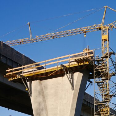 Crane building a bridge